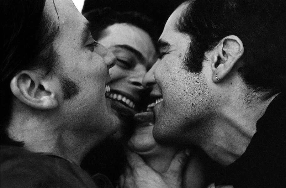 Joseph Rodriguez Vicky’s friends smother him with kisses at a party Vintage silver gelatin print, printed 1997 28 x 35 cm (11 x 14 in.)
